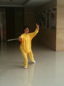 Teacher Yang displaying some of her Taiqi Sword moves (Photo; 11/13 emccall)