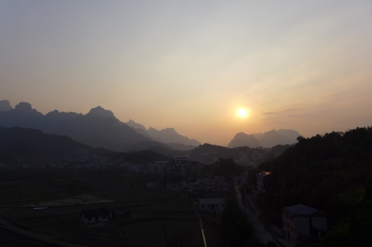 The sunset over the mountains and  zhangjiajie city (Photo: Emccall 1/14)